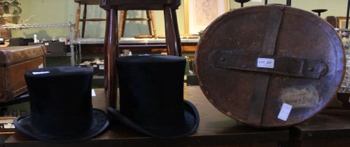 A Victorian leather hat box, together with two silk top hats
