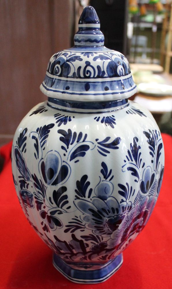 A hand painted Delft glazed earthenware vase of fluted form, having domed cover, cobalt blue floral - Image 2 of 3