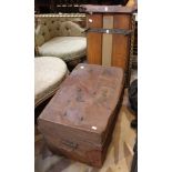 A tin trunk with a vintage wooden trouser press and a brass and wooden magazine rack