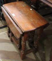 A small oak twin flat gateleg table, with barley twist uprights (a/f)
