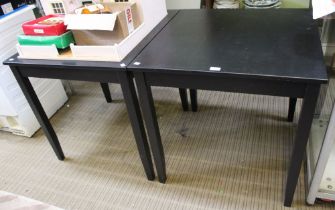 A pair of modern black square pub style tables