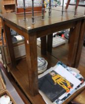 A dark wood square formed pub style table