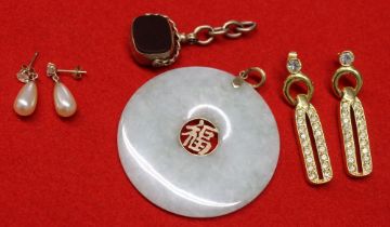 A Chinese Jade disc pendant with 14k mounts, together with a 9ct gold reversible blind fob and two p