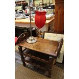 An oak table with Butlers tray removable top, fitted undertiers, together with a table lamp fitted s