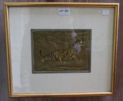 An India Moghul style painting on fabric of a prowling tiger, 14cm x 19cm, framed and glazed