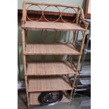 A tall five shelf bamboo wicker display unit