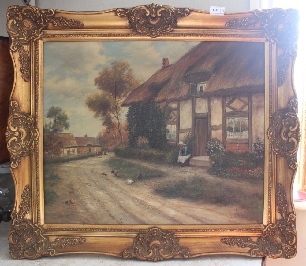A modern canvas of a cottage scene in gilt frame