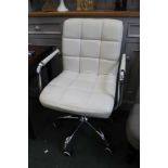A modern white leather swivel office chair