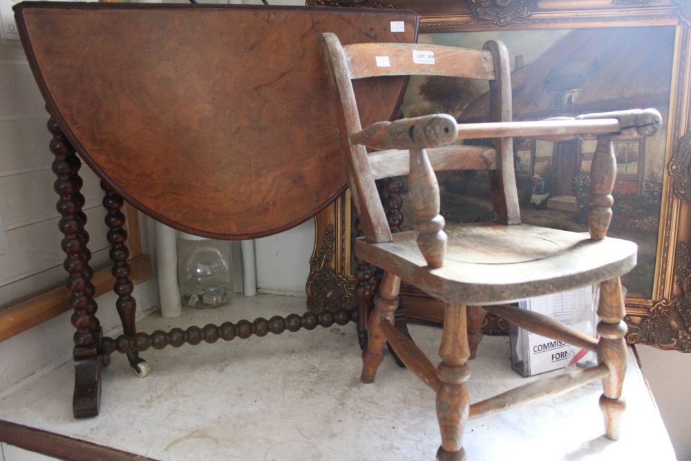 A 19th century oval walnut veneer drop leaf Sutherland table, raised on bobbin turned frame, togethe