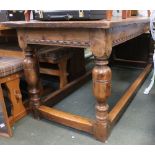 A 19th century oak three plank refectory table with cleated ends on turned legs &