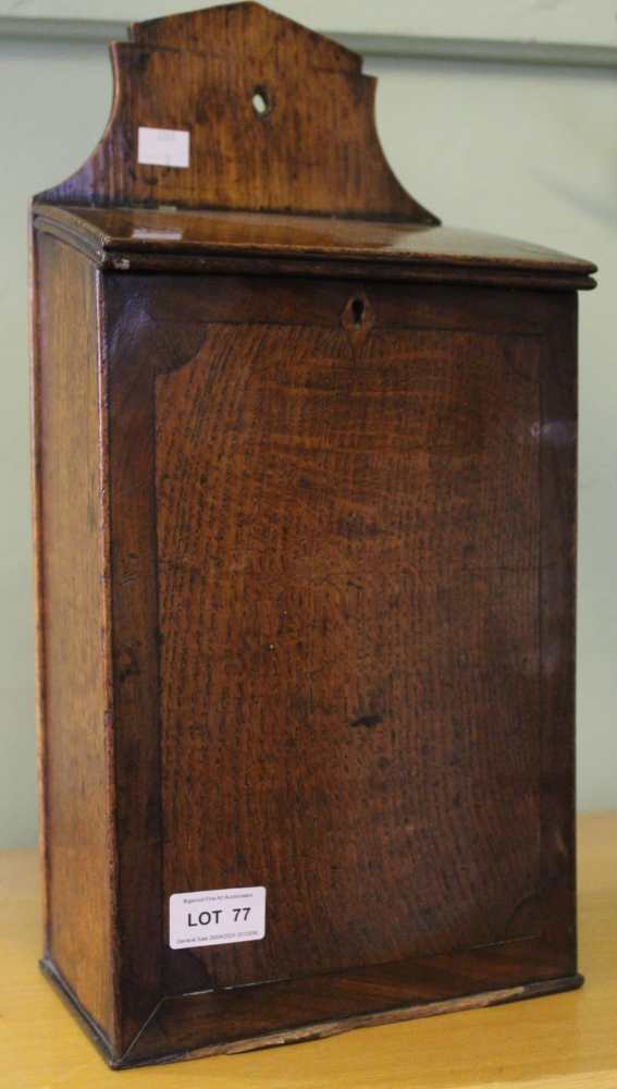 A Georgian oak salt box, mahogany cross banded, fitted hinged sloping cover, 21cm wide, height inclu