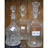 Three cut glass decanters