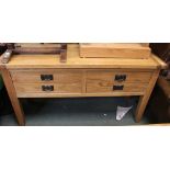 A modern beech wood side table with two drawers