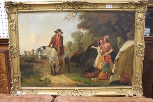 A 19th century oil painting on canvas, "Travellers at rest" an encampment beside a wood, with horsem
