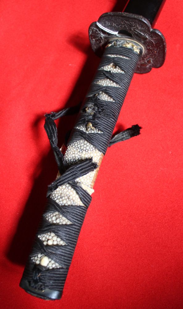 A Japanese sword, shagreen handle, chord wrapped, the cast Tsuba with insect decoration, black lacqu - Image 2 of 3