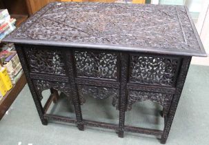 A decoratively carved Anglo / Indian oblong folding campaign table