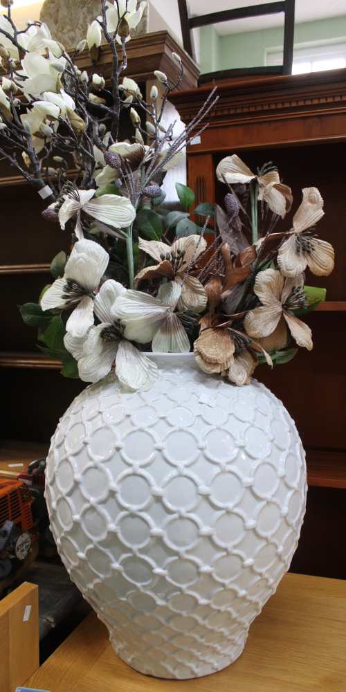 A large modern glazed ceramic vase containing a good selection of ever lasting flowers