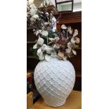 A large modern glazed ceramic vase containing a good selection of ever lasting flowers