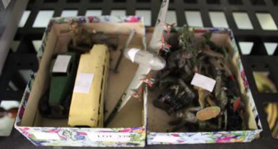 A small box containing a selection of vintage metal soldiers, together with metal car, plane, and bu