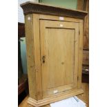 An old pine rustic wall hanging corner cupboard