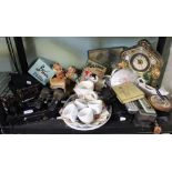 A shelf of useful and collectible items to include Pendelfin figures, binoculars, clock etc