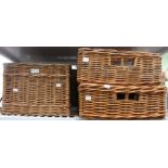 A shelf containing five wicker baskets