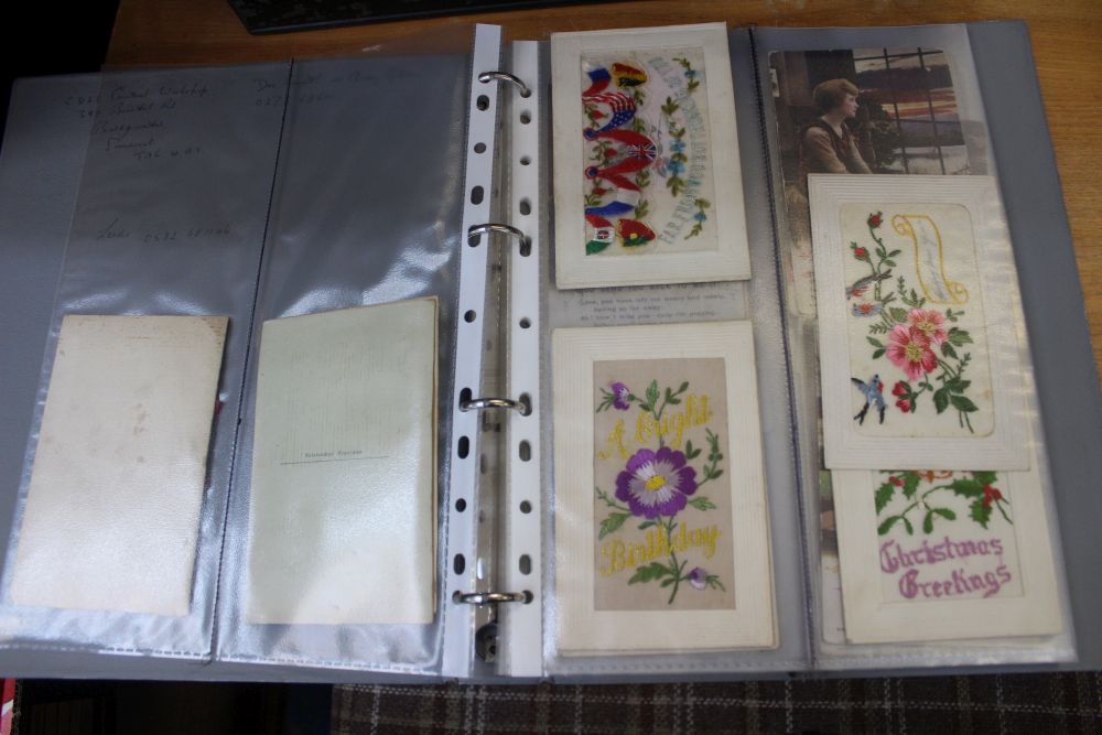 A folder containing a good selection of First World War era postcards including silks etc