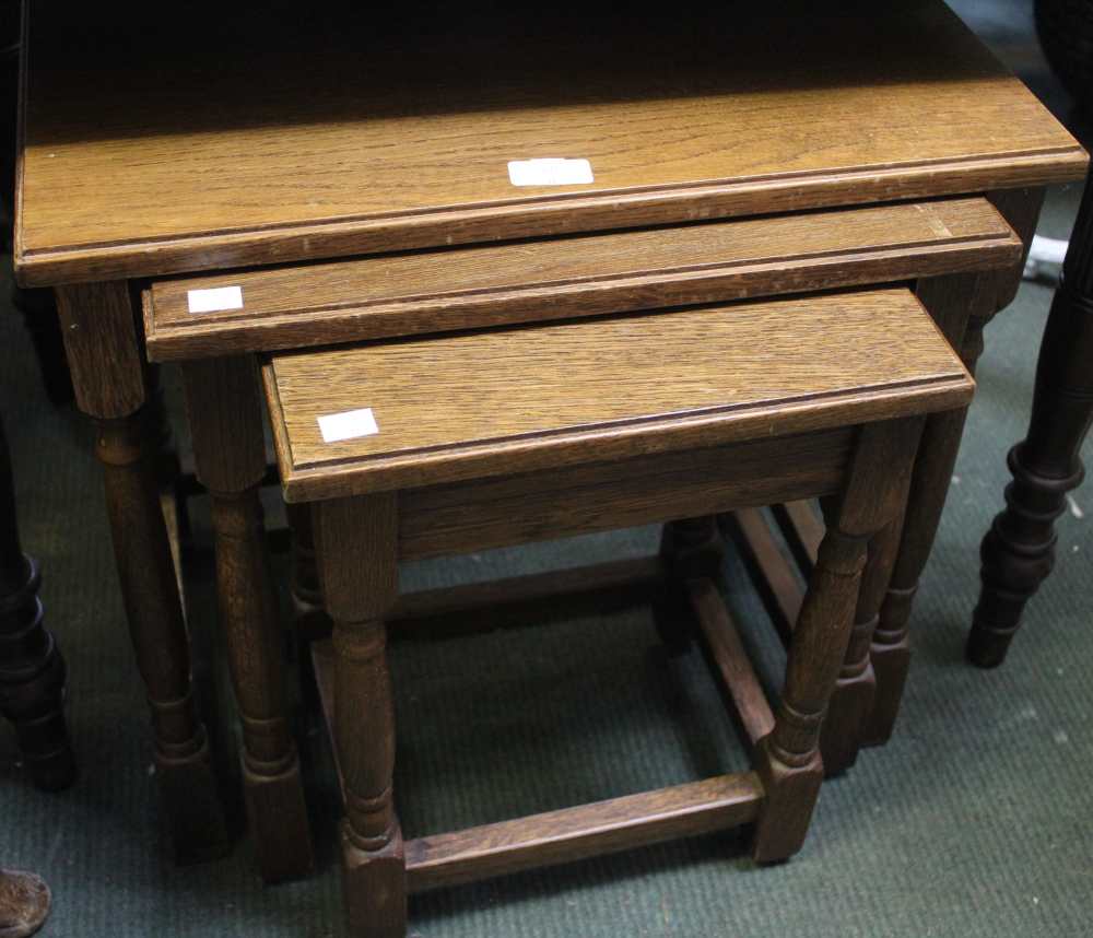 An oak nest of three tables