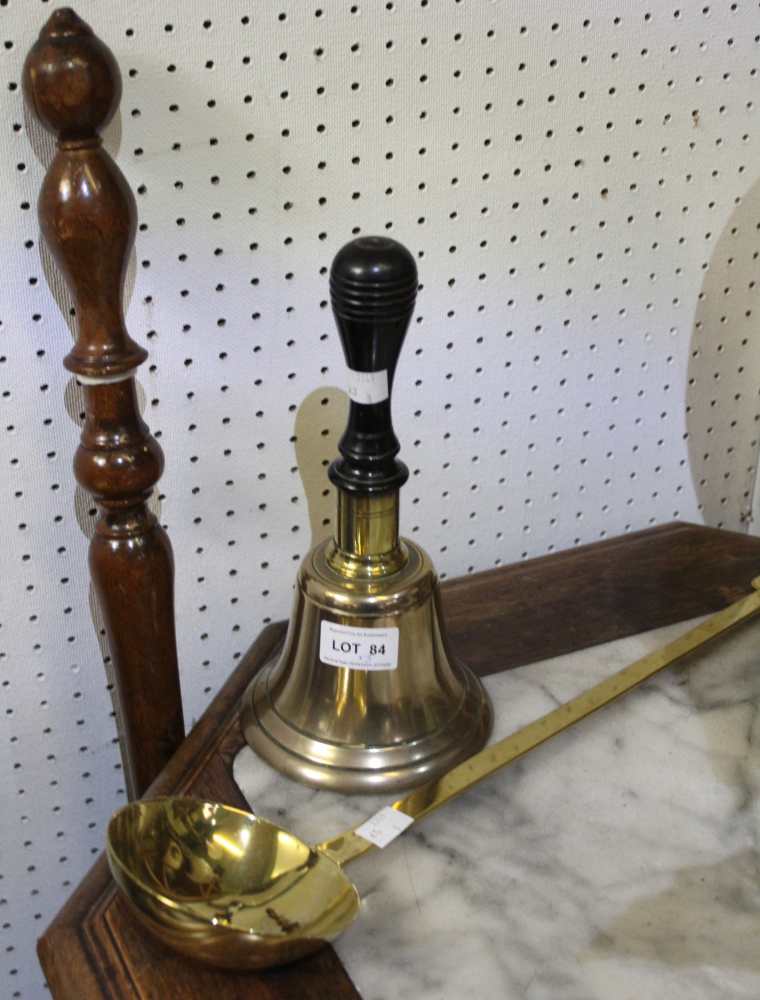 A hand bell with an ebonised handle, a brass ladle and a warming pan with turned wood handle (3)