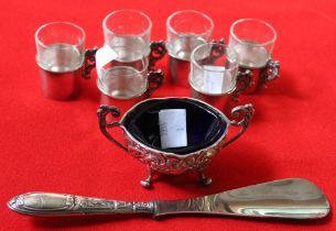 A set of six glass liquor tots in hallmarked silver holders, with cast flora handles, a hallmarked