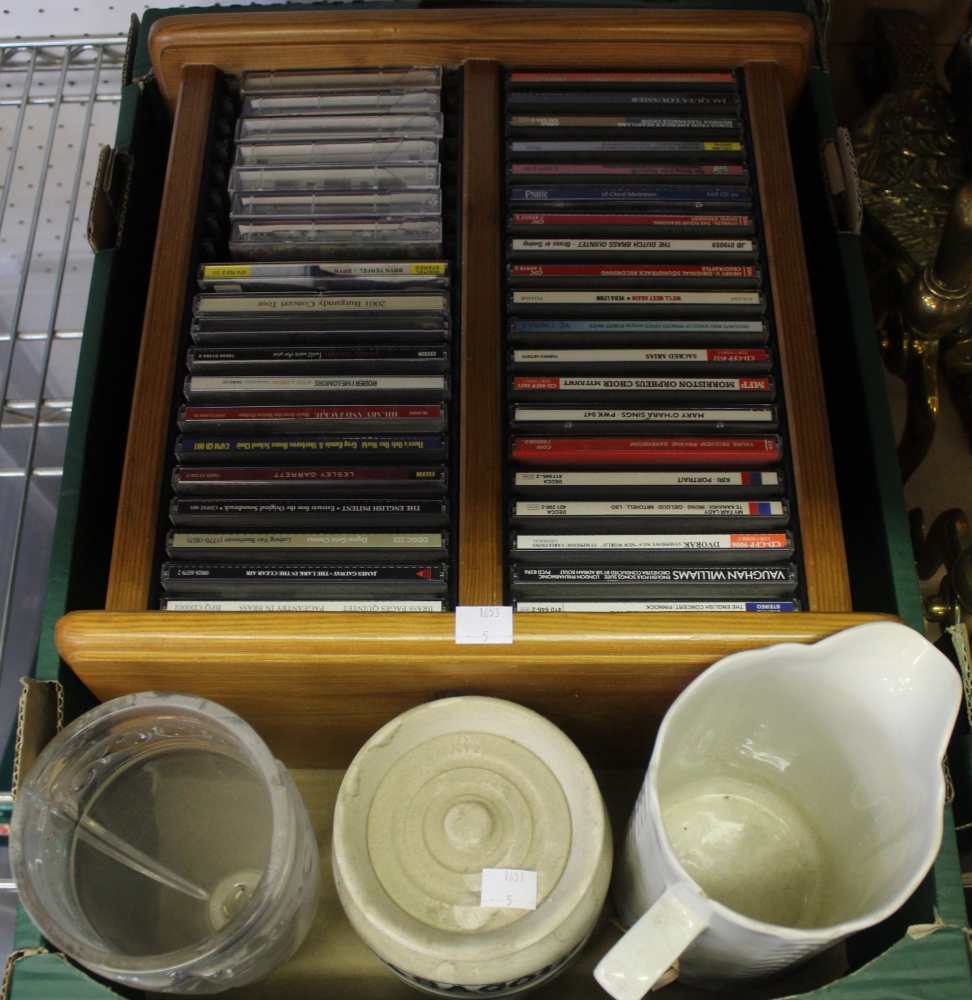 A box containing a wooden CD holder with CD's etc