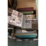 A box containing a selection of photo albums