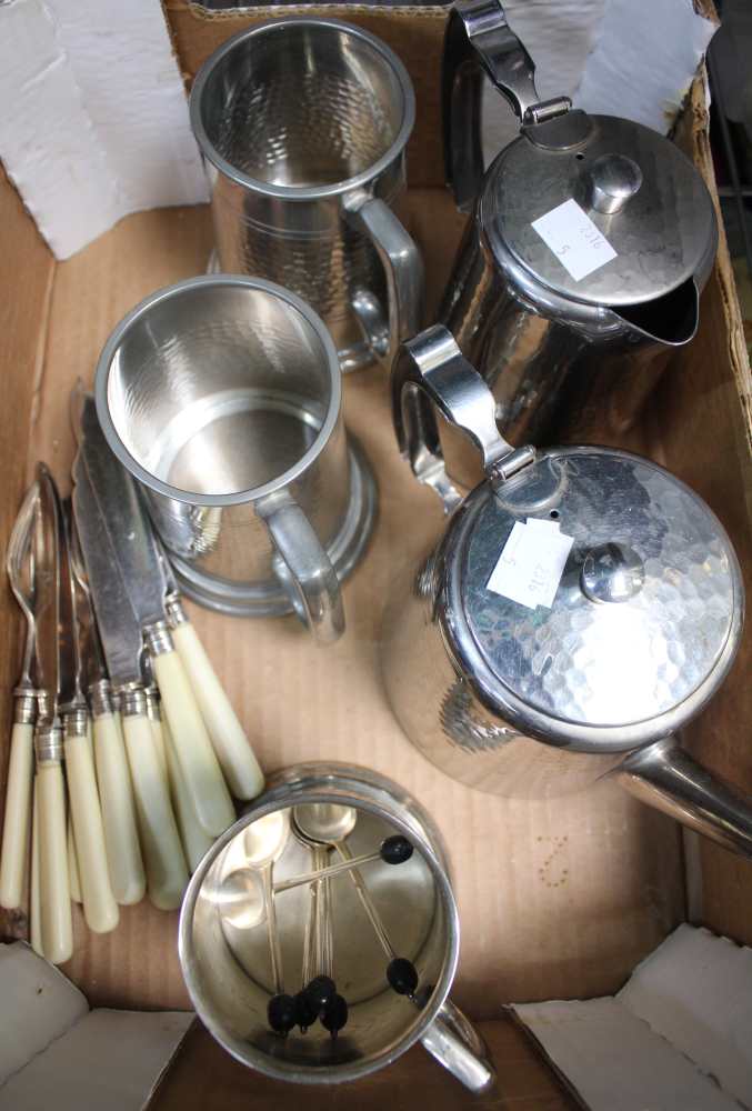 A box containing a selection of metal wares including tankards, tea pots etc