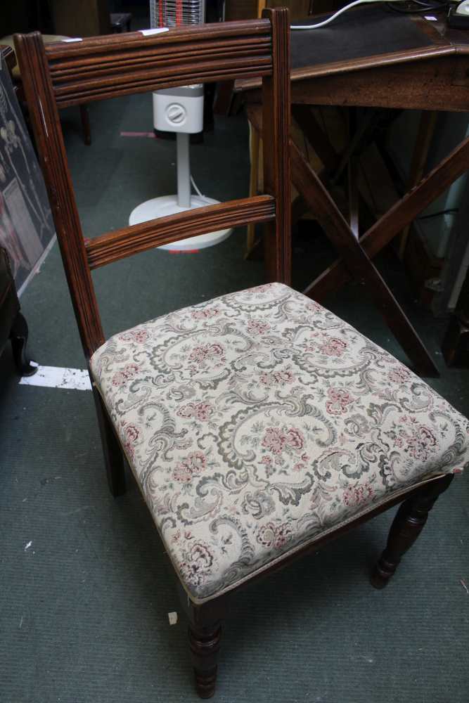 A set of four early 20th century bar back tapestry upholstered dining chairs