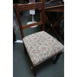 A set of four early 20th century bar back tapestry upholstered dining chairs