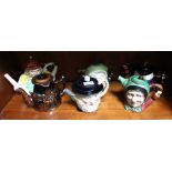 A 19th century Staffordshire pottery "Toby" type splits teapot together with five other figurative a