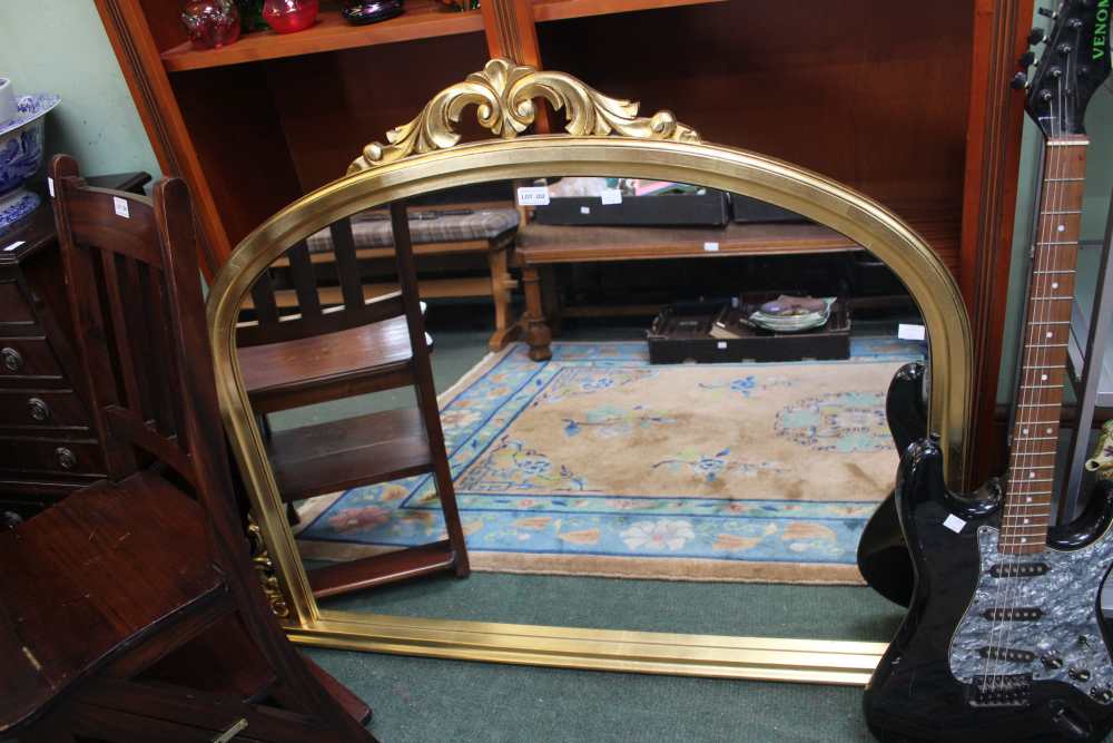 A large modern gilt over mantle mirror