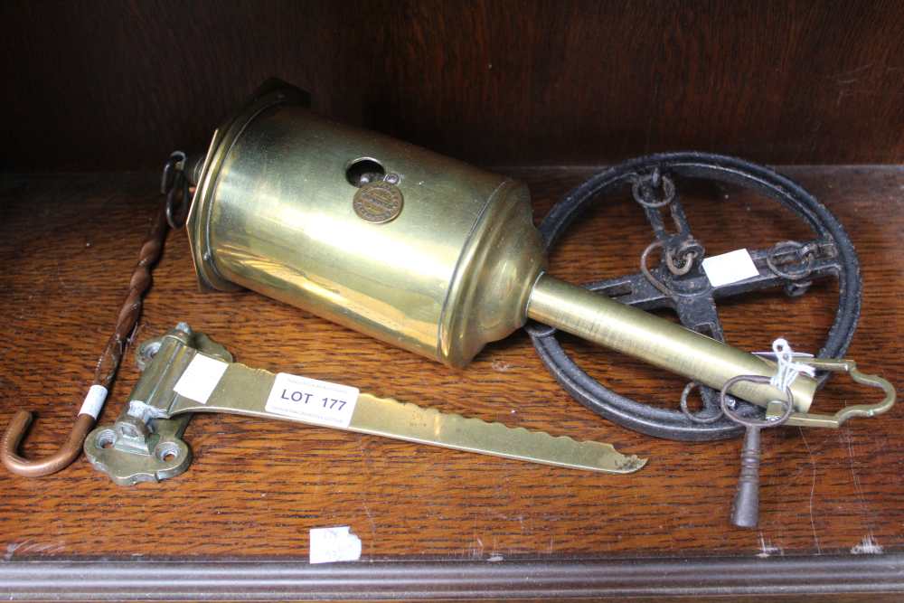 A brass clockwork spit-engine, with wall bracket, extra hook and iron meat wheel (with key)