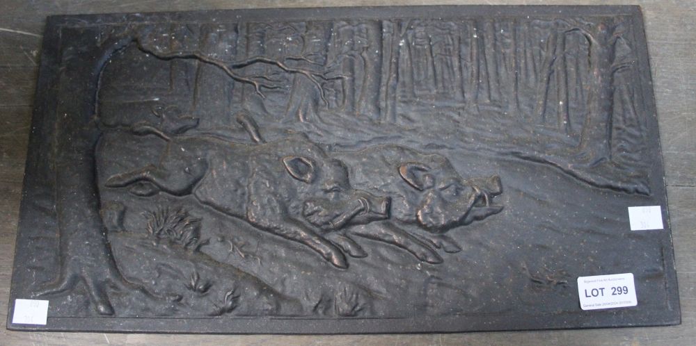 A 20th century cast iron panel, depicts running Boar in a forest, possibly German 23cm x 45cm