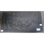 A 20th century cast iron panel, depicts running Boar in a forest, possibly German 23cm x 45cm