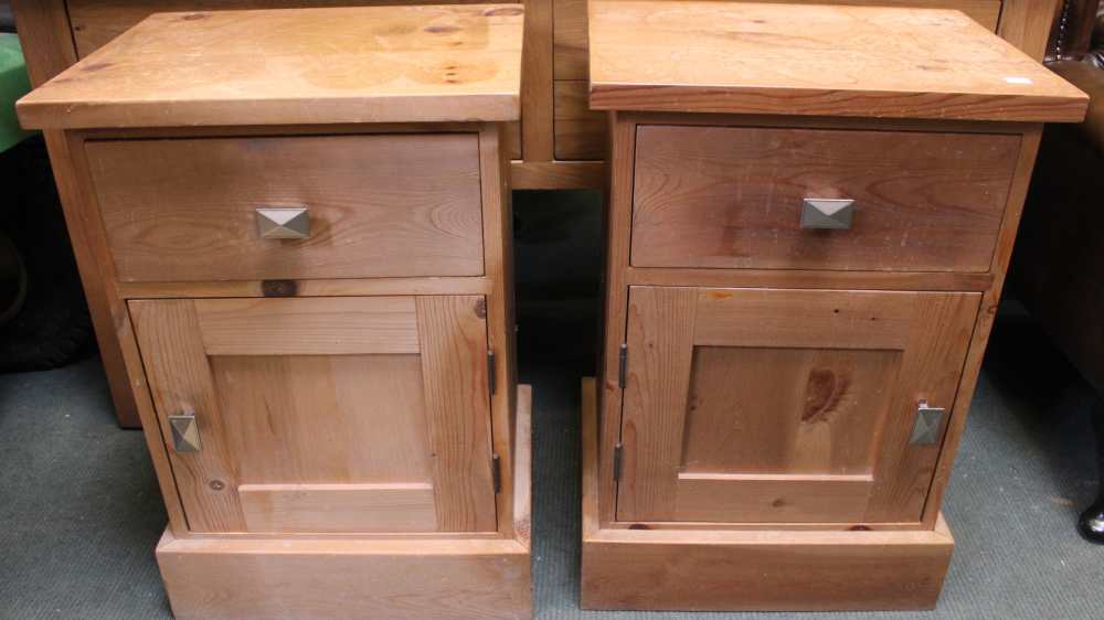 A pair of modern pine bedside units
