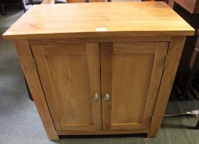 A modern oak two drawer cupboard