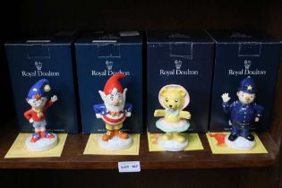 A shelf containing four Royal Doulton characters from Enid Blyton's Noddy. boxed with certificates