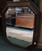 A bevel edged, oak framed early 20th century wall hanging mirror