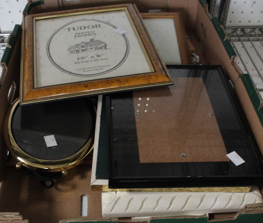 A box containing a quantity of photo frames