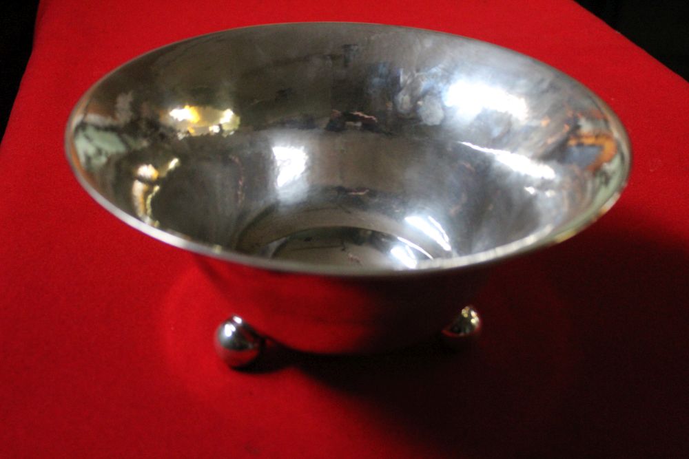 C G Hallberg, a Swedish silver fruit bowl, tapering planished form, raised on three ball feet, bears