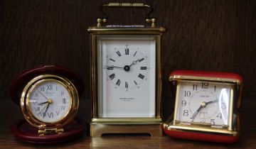A Taylor & Bligh carriage clock, together with two travelling clocks