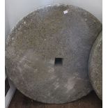 An old circular mill stone 76 cm diameter