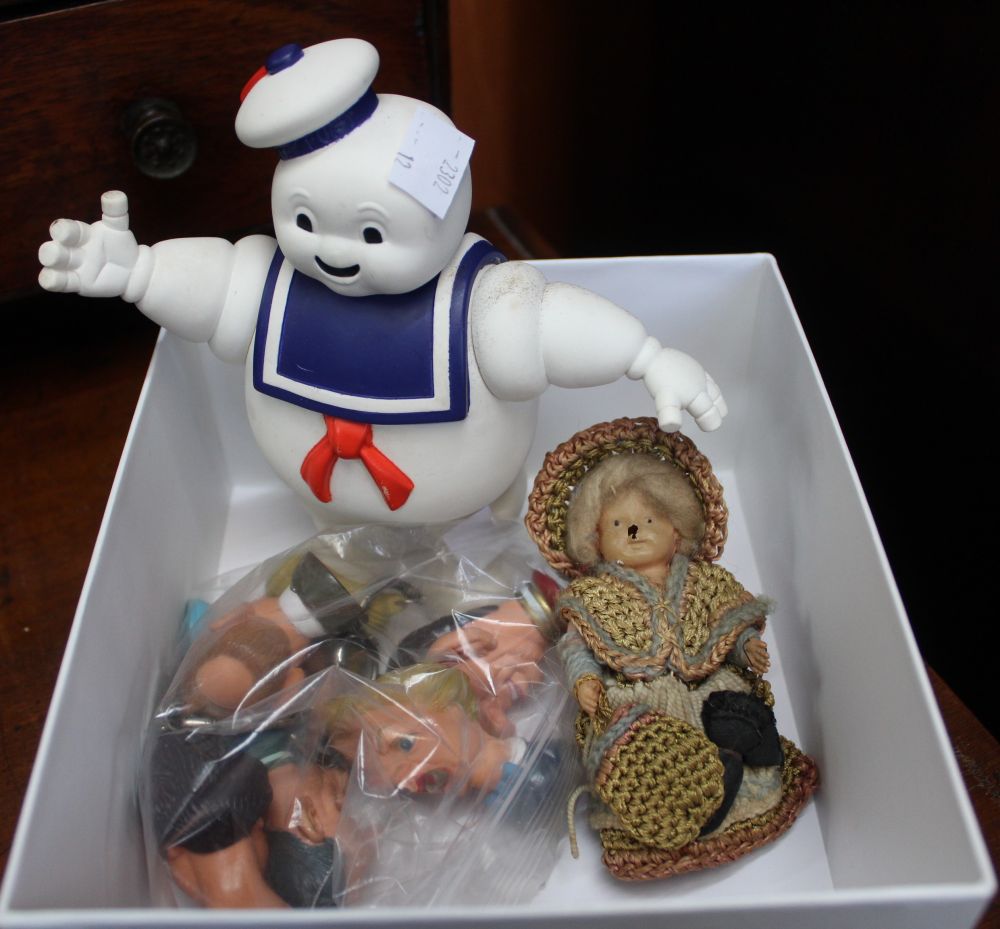 A lot containing six Spitting Image key rings, a Ghost Busters toy and a vintage doll