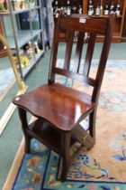 A modern hardwood metamorphic chair/library steps